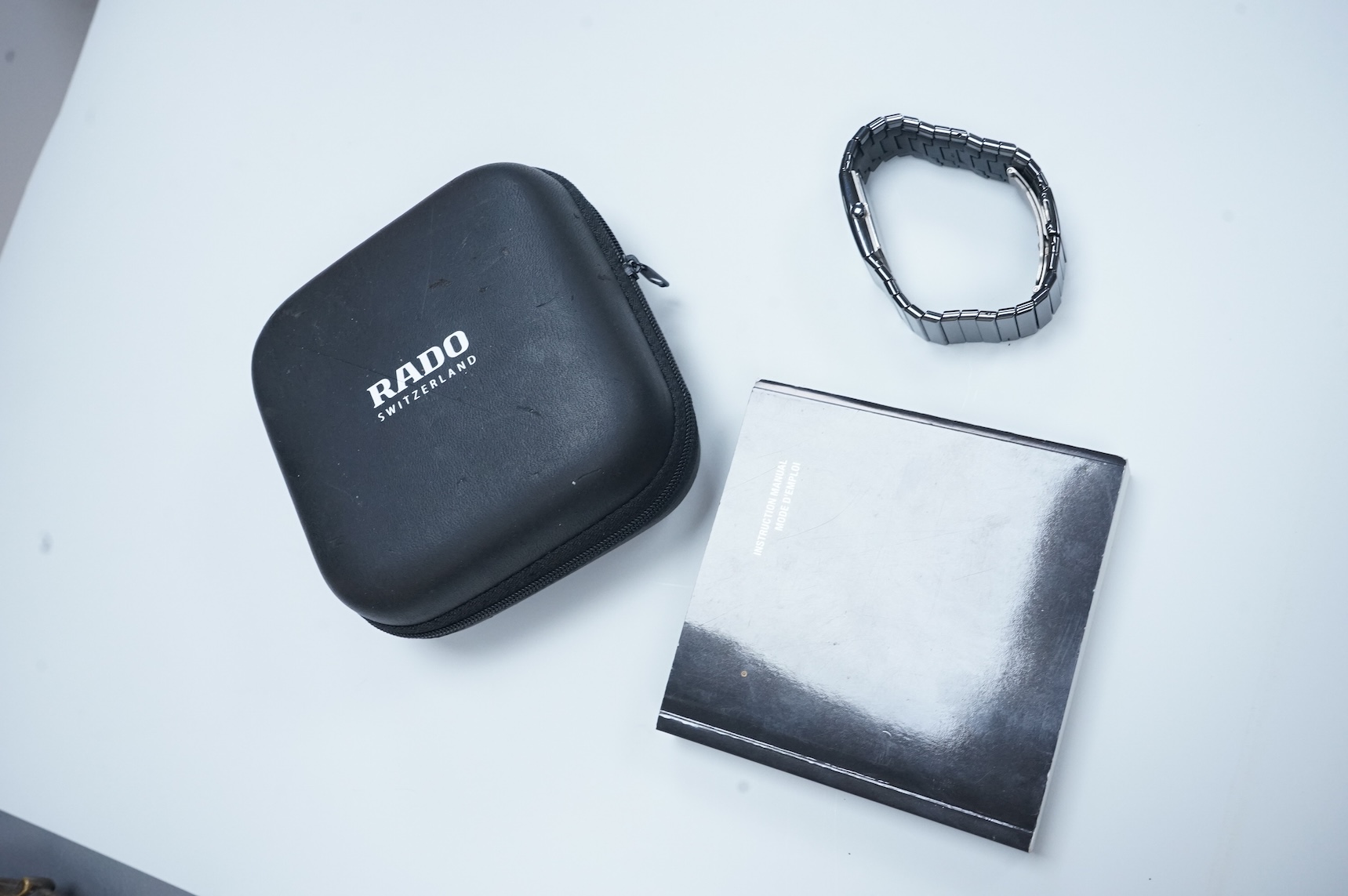 A modern Swiss titanium and ceramic Rado Diastar quartz wrist watch, with rectangular dial and dot markers, case diameter 25mm, with Rado box and booklet.